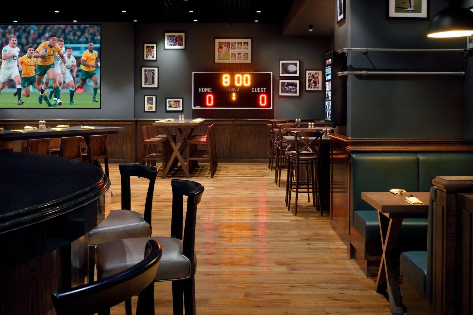 فندق العنوان مرسى دبي المظهر الخارجي الصورة Interior of a typical Buffalo Wild Wings restaurant